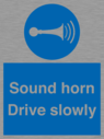sound-horn-drive-slowly-warehousing-and-delivery-sign~